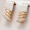 Gold und glitzernde Chrysalis-Ohrringe