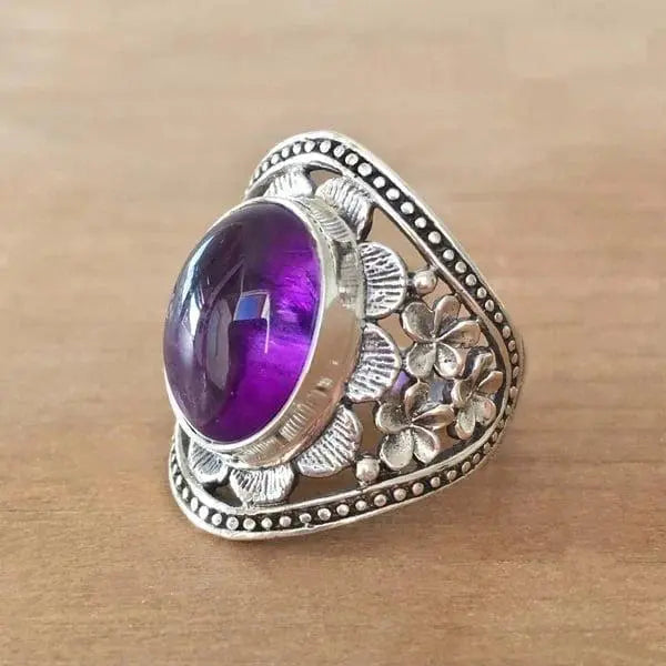 Blumenring mit violettem Edelstein