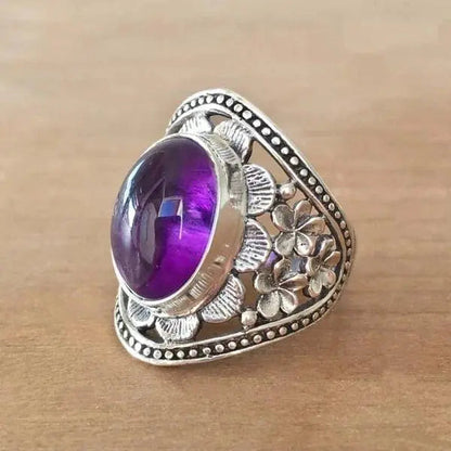 Blumenring mit violettem Edelstein