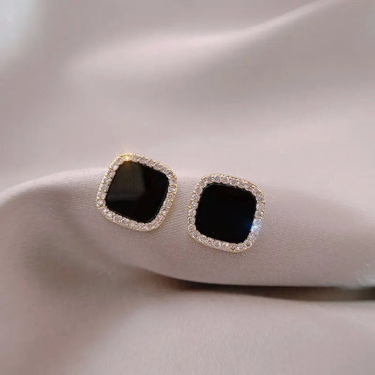 Zeitlose Onyx-Ohrringe mit Diamanten